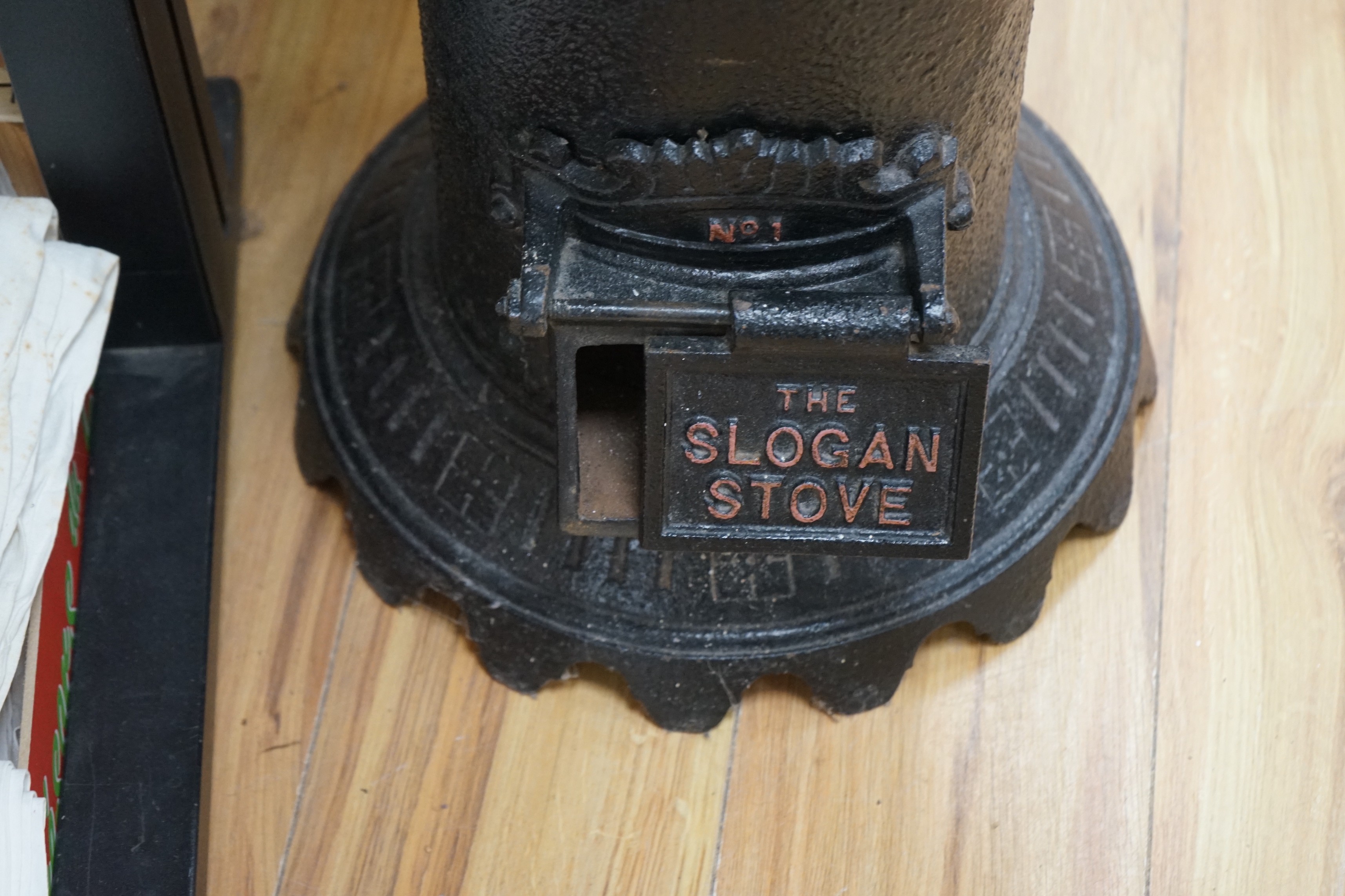A black cast iron stove - 'The Slogan Stove’, 58cm high